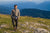 robert stolz standing on mountain top in salzburg wearing the clemens boiled wool jacket