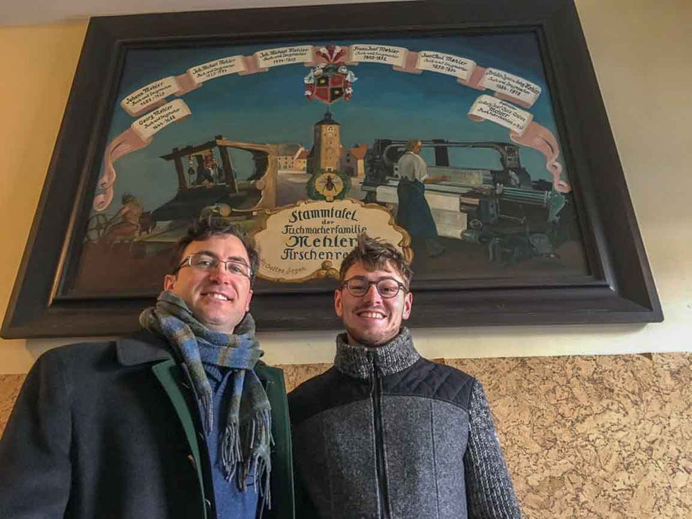 Robert W. Stolz with Maximilian Mehler standing in front of Stammtafel for the 350+ year old family run Mehler Mill