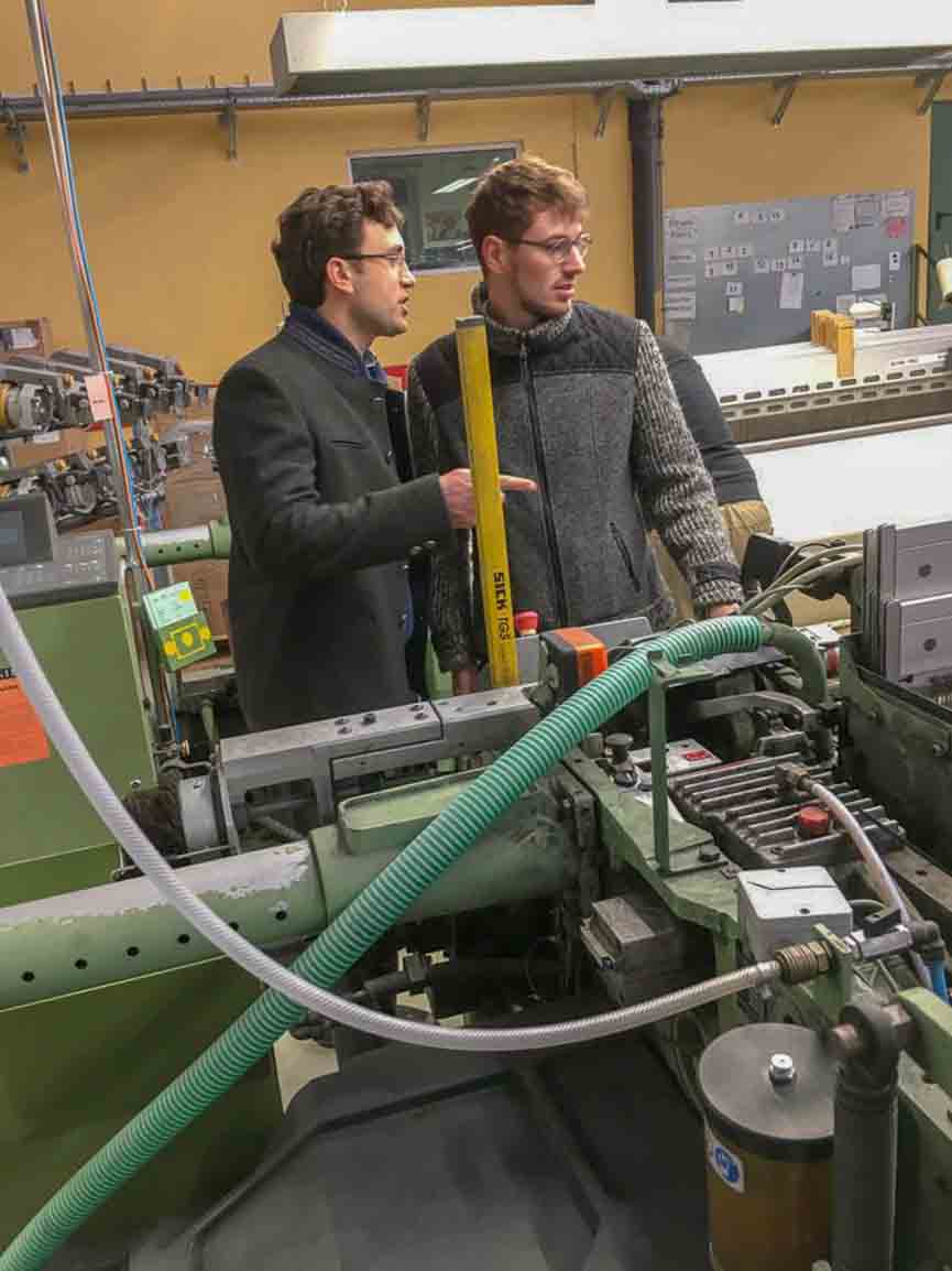 Robert W. Stolz inspecting weaving operations at the Mehler Mill in Bavaria