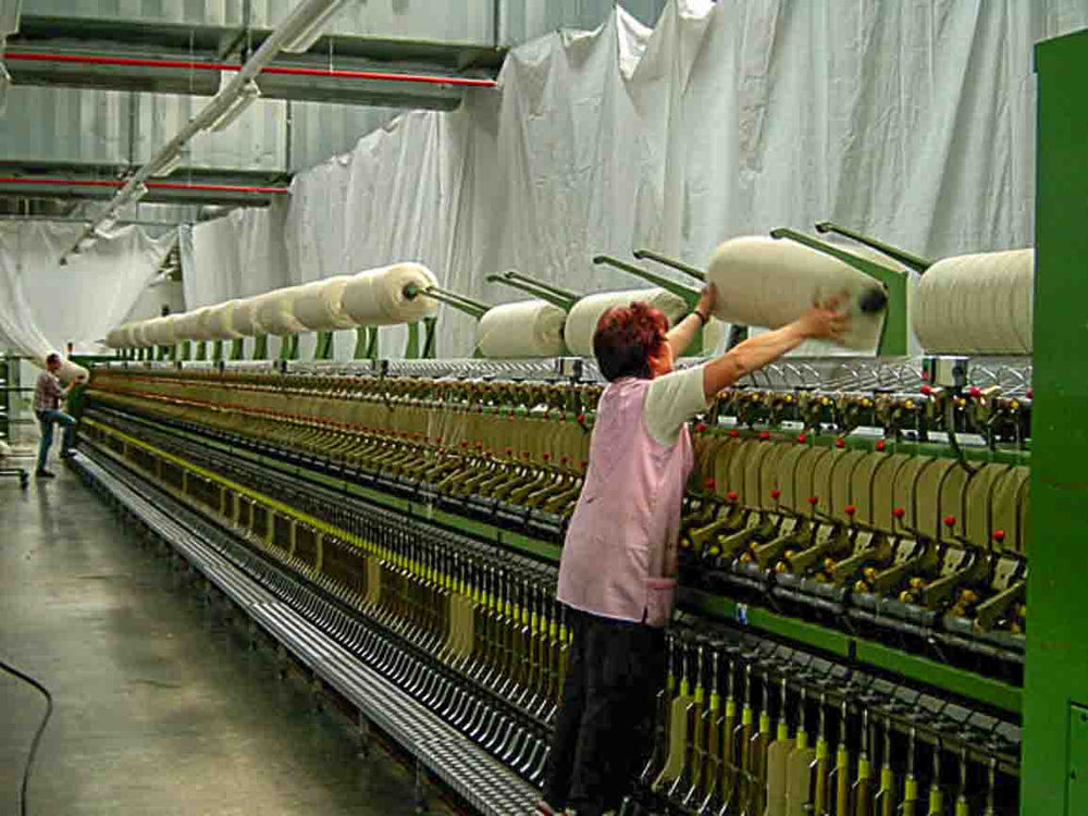 german women operating spinning machines in traditional bavarian mill