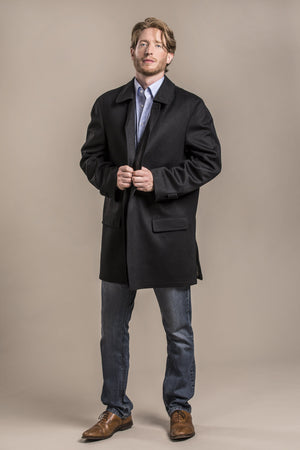 a profile view of a 30 year old man wearing an austrian himalaya loden wool overcoat