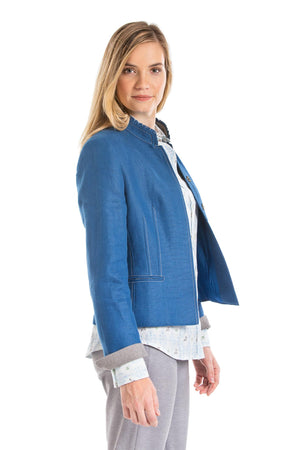 young blonde women wearing a blue Austrian linen riding jacket