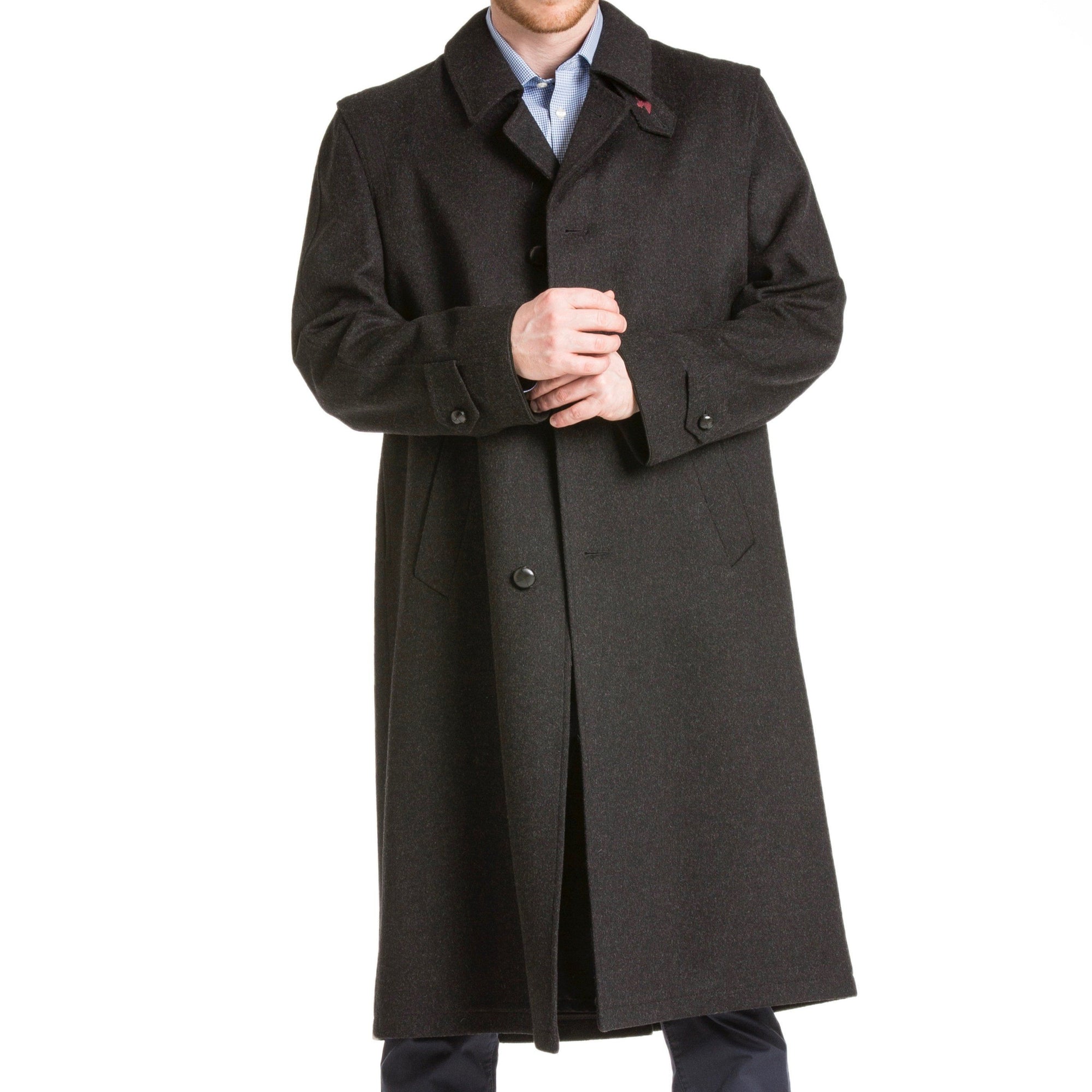 man wearing a black cashmere full length loden overcoat