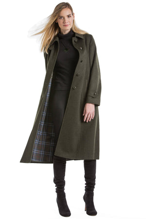 30 year old blonde woman wearing a Robert W. Stolz Austrian loden wool coat 