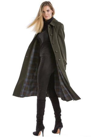 30 year old blonde woman wearing a luxury Robert W. Stolz Austrian loden wool coat 