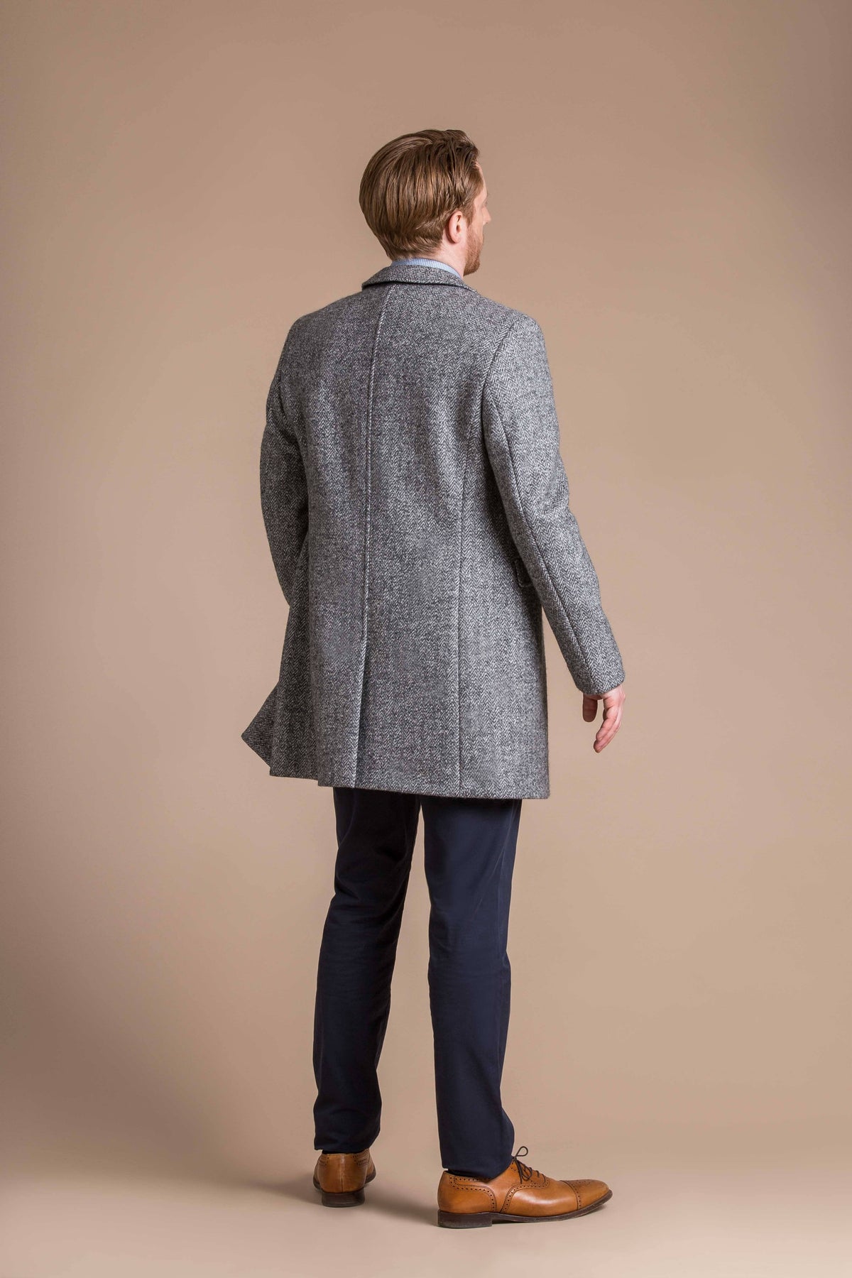 man wearing a Robert W. Stolz boiled wool herringbone weave overcoat 