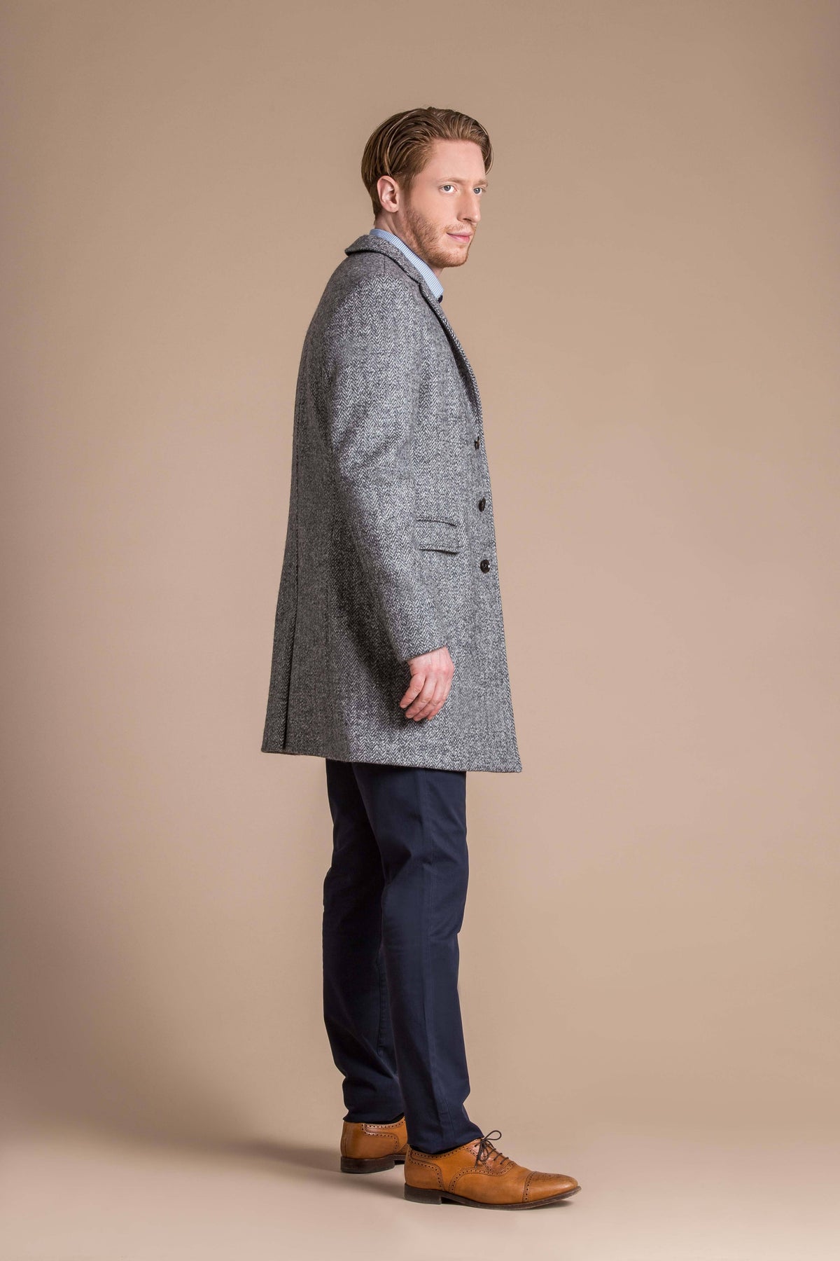 man wearing a Robert W. Stolz boiled wool herringbone weave overcoat 