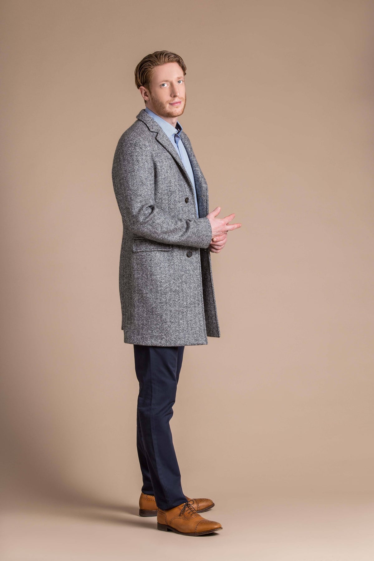 man wearing a Robert W. Stolz boiled wool herringbone weave overcoat 