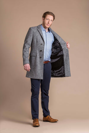 man wearing a Robert W. Stolz boiled wool herringbone weave overcoat 